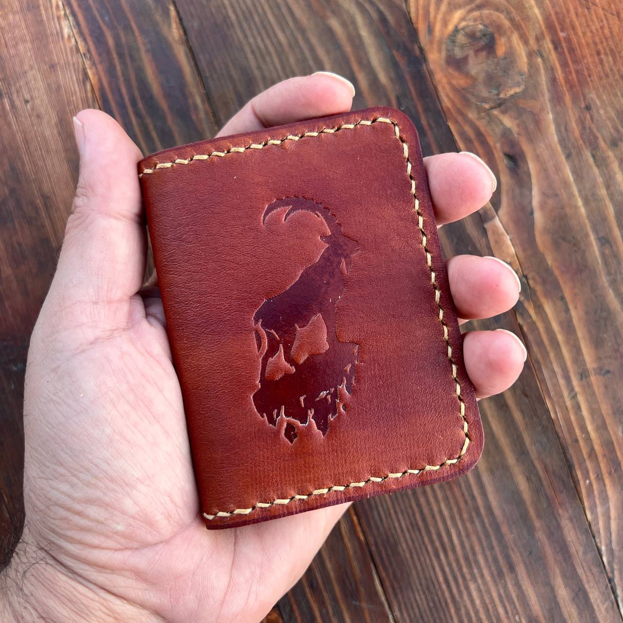 Brown card holder with capra pattern