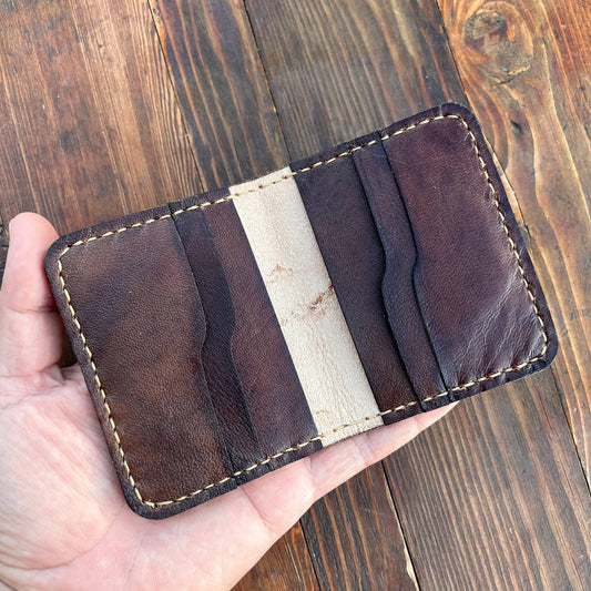Brown card holder with capra pattern