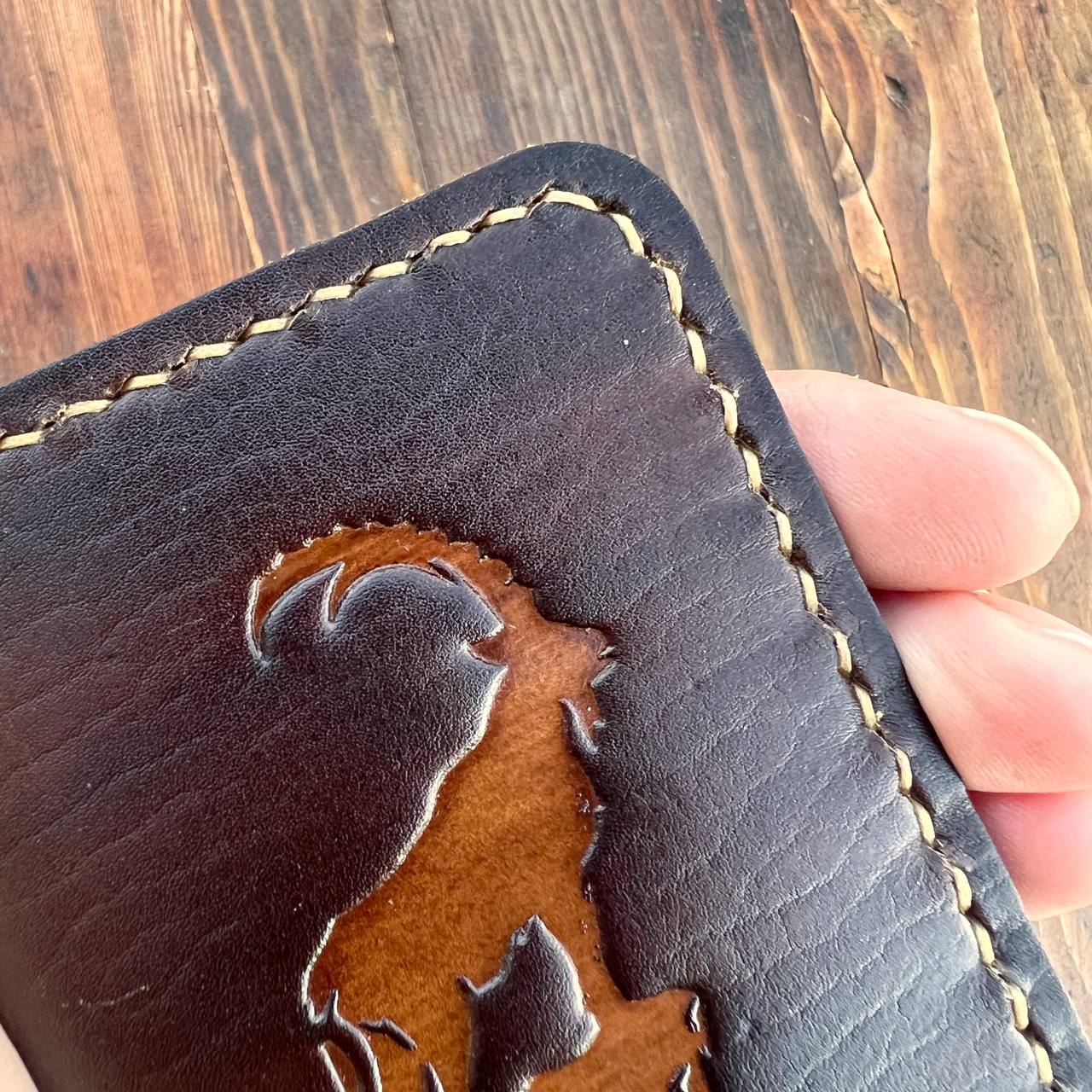 Brown card holder with capra pattern
