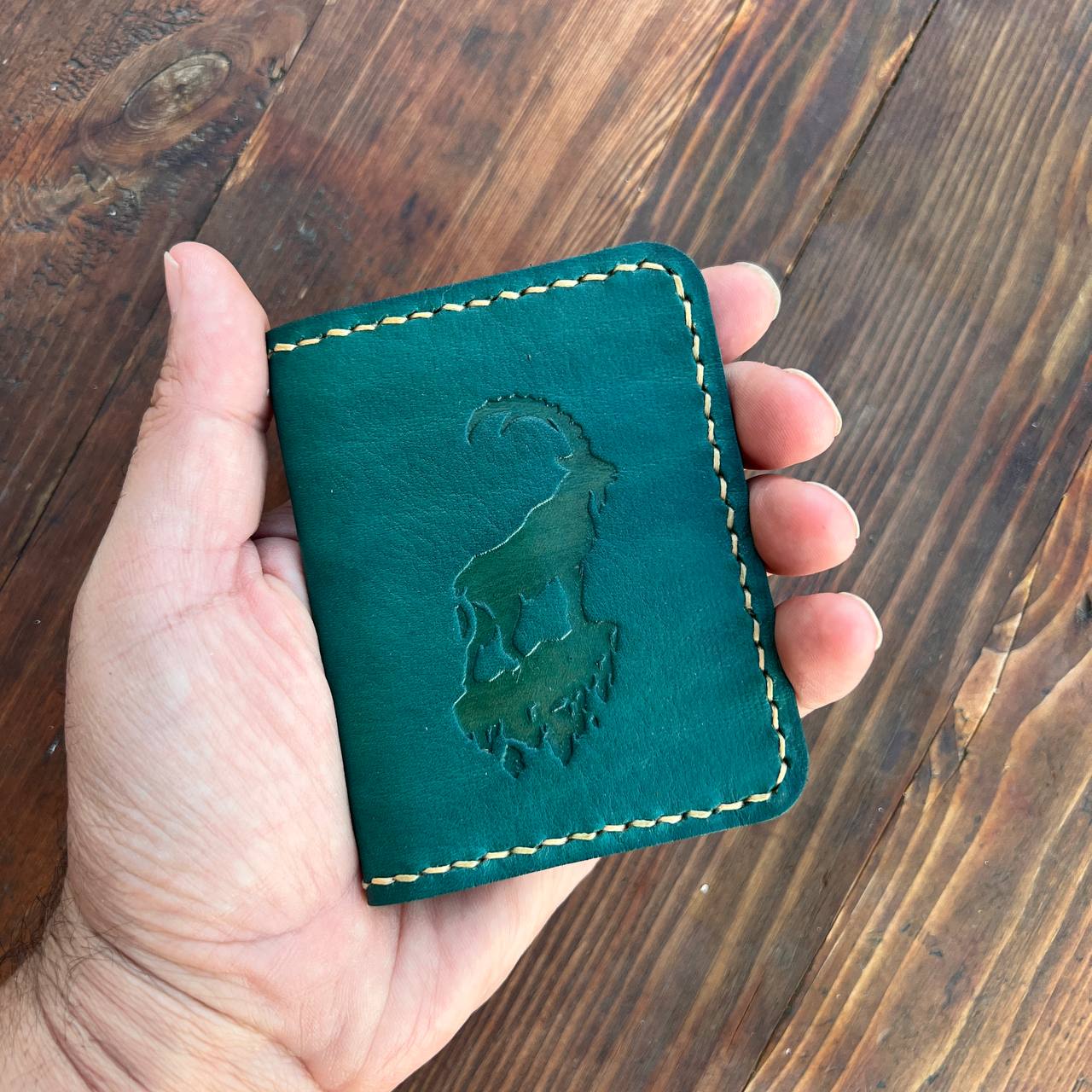 Brown card holder with capra pattern