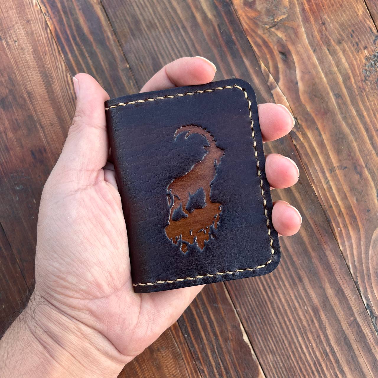 Brown card holder with capra pattern